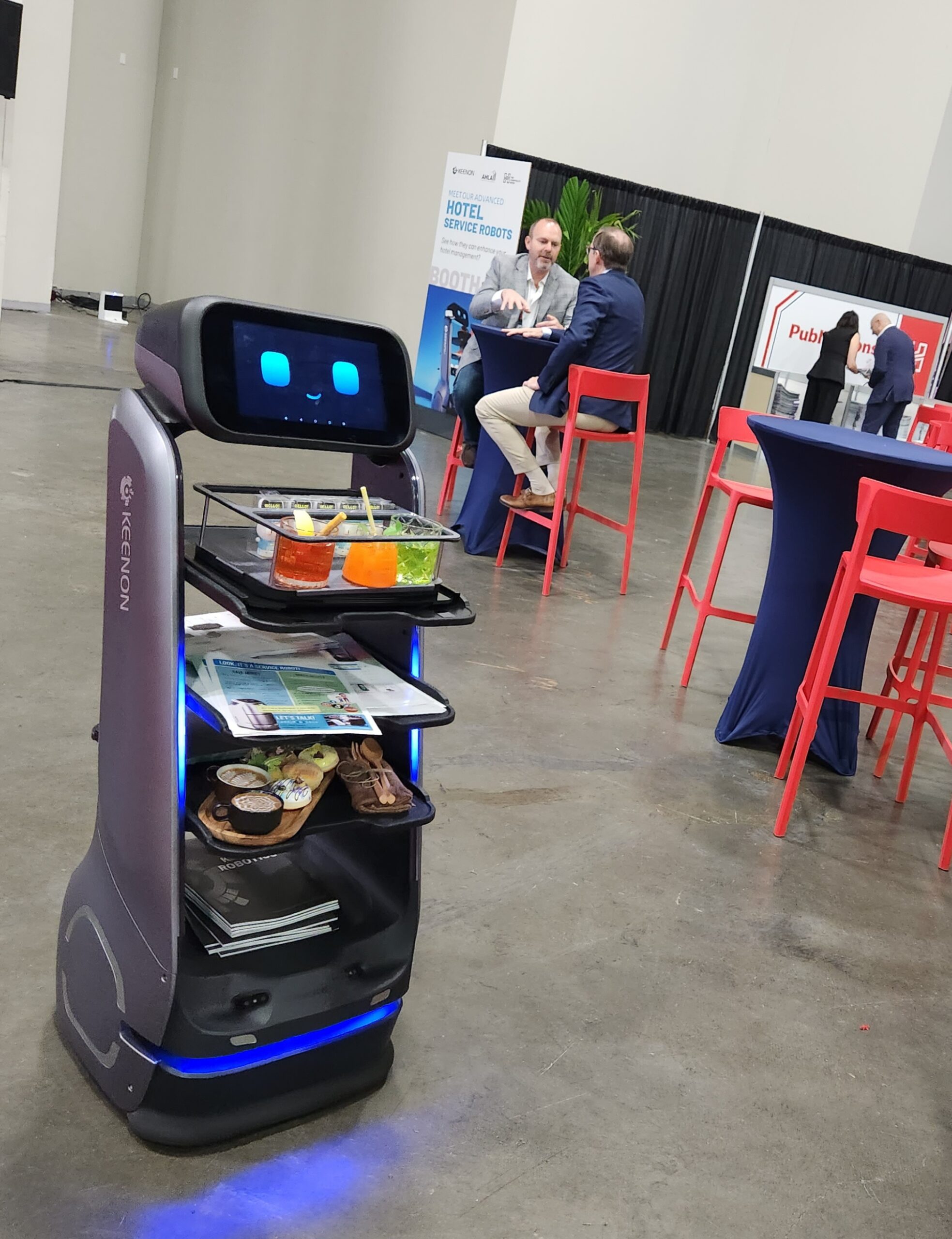 A robot serves attendees at The Hospitality Show in Las Vegas, NV.