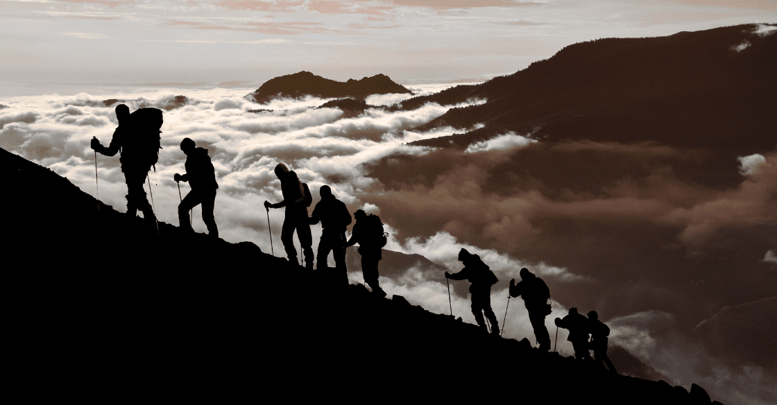 A team hikes at high altitude