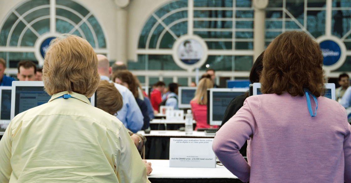 Convention attendees seated at panel